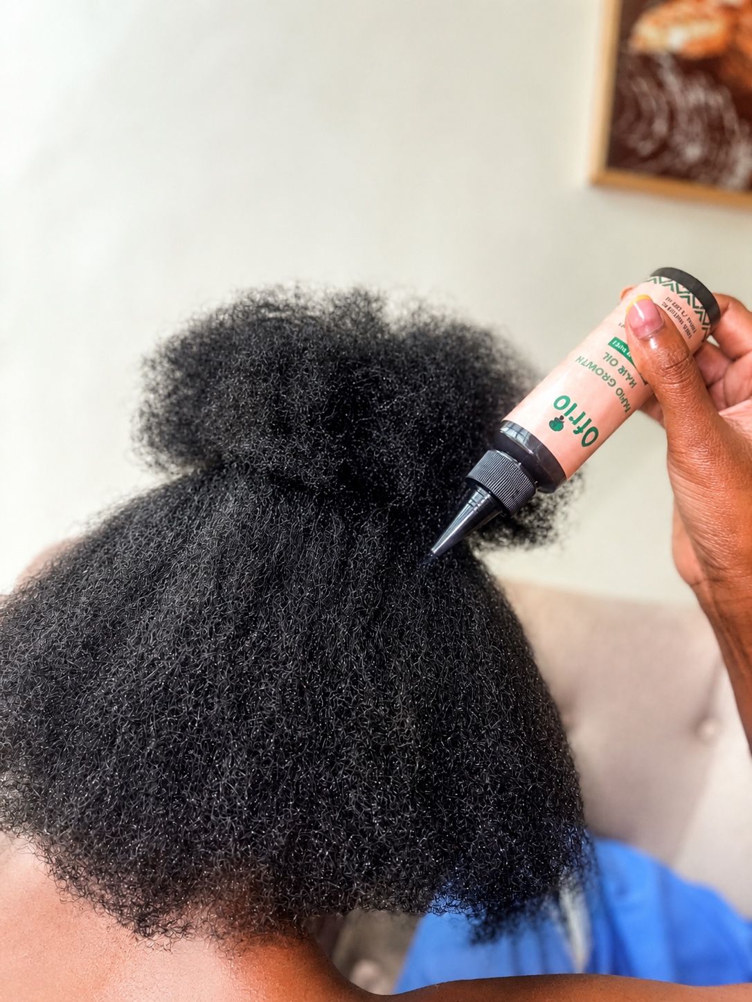 Ofrio Rapid Growth Hair Oil applied to textured hair